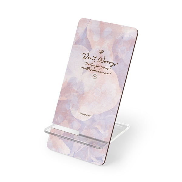 Display positivity and encouragement with the 'Don't Worry, Tough Times Fade' mobile display stand, featuring a vibrant purple and pink orchid floral design. A meaningful and practical gift for those in need of support, this stand offers a constant reminder to stay strong during tough times, while keeping your phone secure and accessible. PicaBright