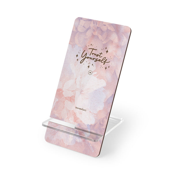 A meaningful 'Trust Yourself' phone display stand featuring a pink blossom design, perfect for keeping your phone organized while reminding you to trust your inner strength. PicaBright