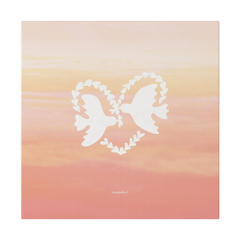 ‘Heart Doves of Love’ canvas print featuring doves in a heart against a dreamy pink-orange sky. The perfect romantic gift to bring love, peace, and serenity to any space. PicaBright