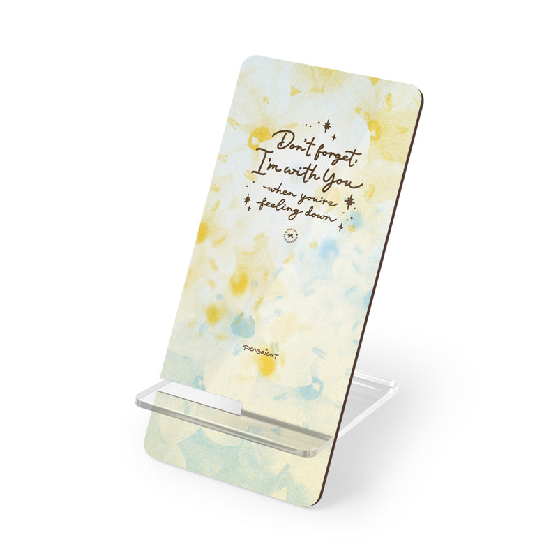 Show your unwavering support with the 'With You Through It All' phone stand, featuring a serene white, yellow, and blue floral design. A meaningful gift for someone experiencing mental health struggles, offering a practical tool and a heartfelt reminder of your presence. PicaBright