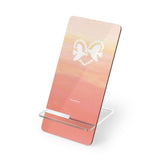 Heart Doves of Love’ smartphone stand featuring two doves forming a heart with soft pink-orange clouds. A romantic and meaningful gift to symbolize love, peace, and mutual support. PicaBright