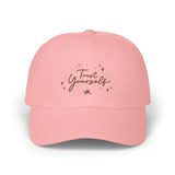 Stay confident and inspired with the 'Trust Yourself' dad cap in pink blossom. Featuring empowering embroidered text, this cap encourages self-belief and positivity. Ideal for those seeking daily reminders of their inner strength. PicaBright